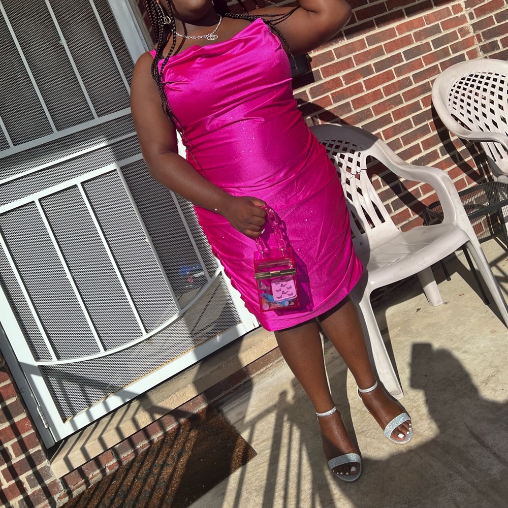 This is a pink Fuchsia pink bodycon prom dress from David’s Bridal.